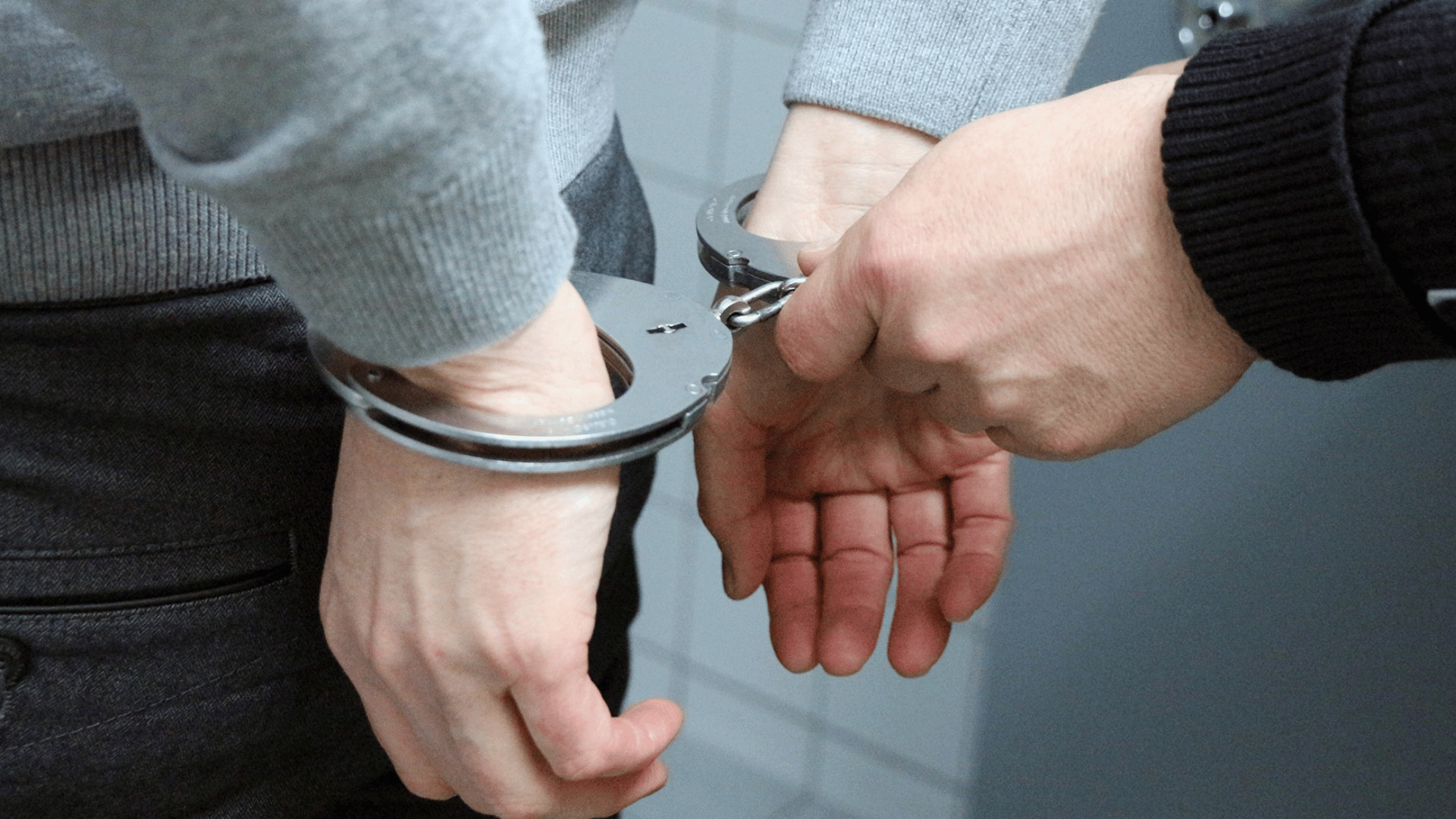 Person arrested with handcuffs. Criminal lawyers Sydney. Bail Lawyers Sydney