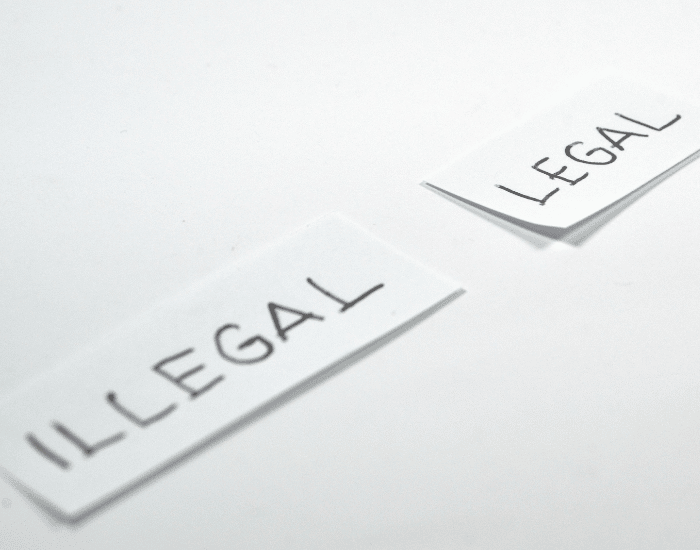 legal and illegal written on pieces of paper