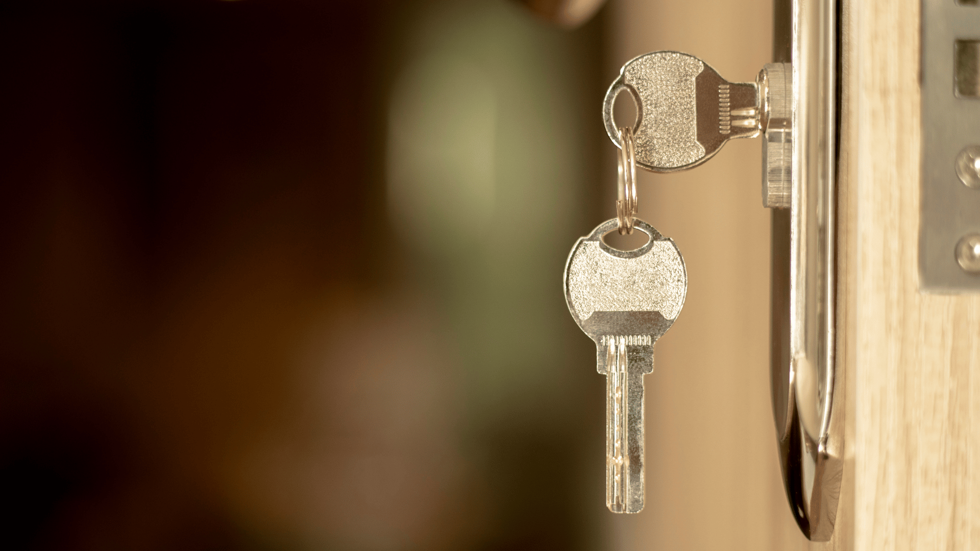 Key in door symbolising purchase of property. Property Conveyancing Sydney.